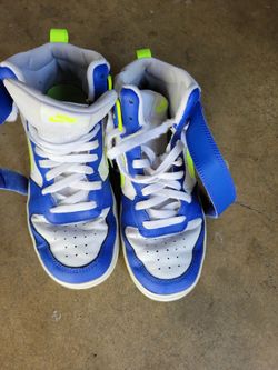 Used blue white green Nike shoes