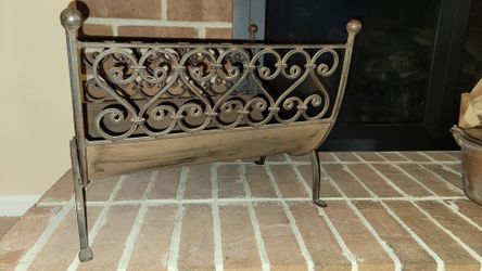 Wrought iron fireplace magazine or log rack scrollwork detail