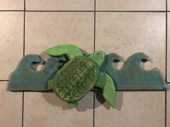 Solid wood hand crafted sea turtle in wave