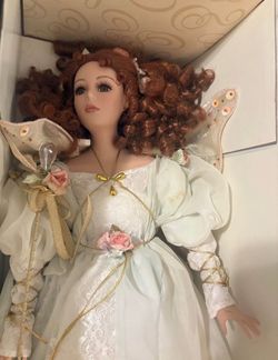 The San Francisco music box company porcelain doll with angel wings