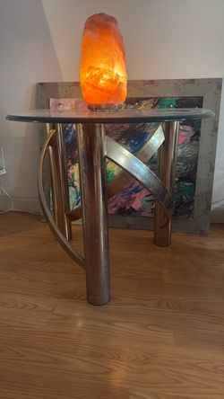Glass table with brass legs