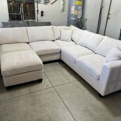 Ivory Sectional With Ottoman