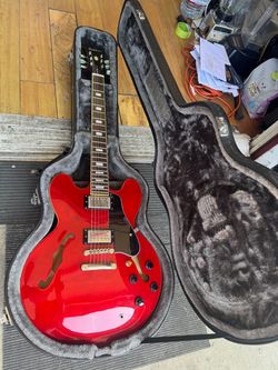 Epiphone ES-335 Pro semi-hollowbody electric guitar in a cherry red