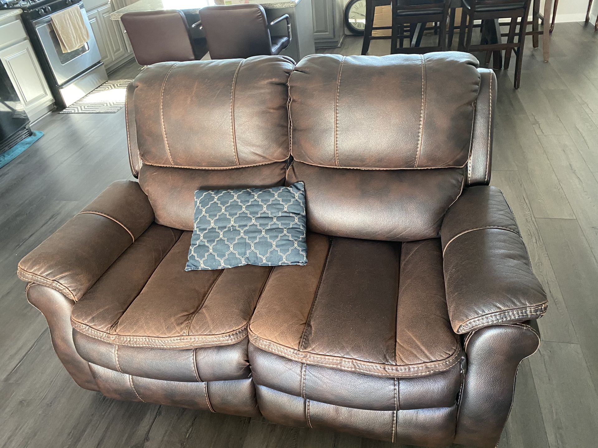 2 piece leather sofa. (Used). Electric recliners!! (Ashley brand)