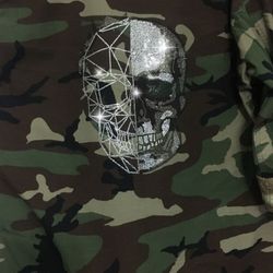 Beautiful vintage military camouflage jacket reworked with Rhinestone skull on the back size Large