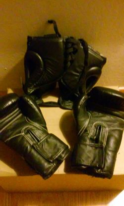 8oz. Boxing or kickboxing gloves and small size head gear.