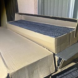 Commercial carpet pieces several boxes.