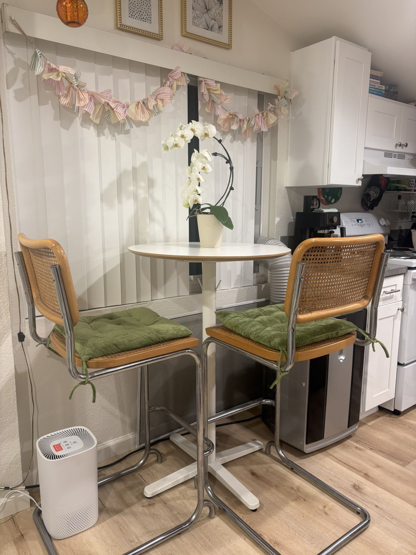 Tall dining table with rattan bar chairs