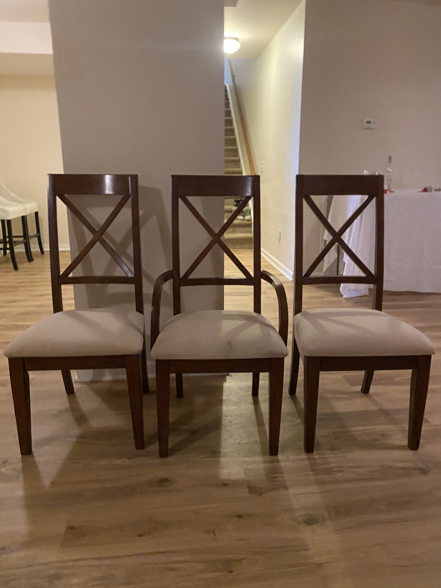 Table With Three Wooden Chairs