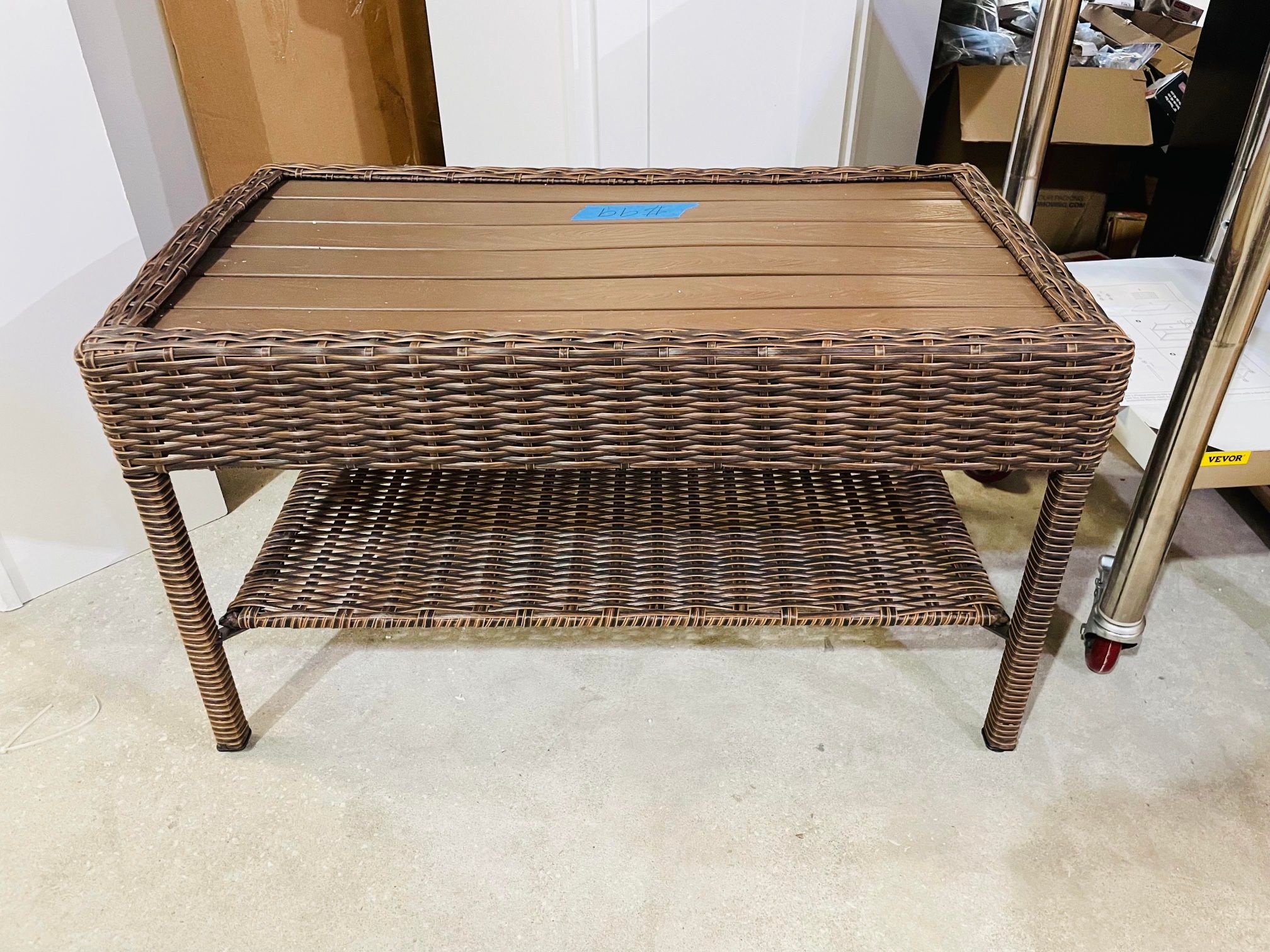 Hampton bay cambridge brown rectangular wicker outdoor on sale patio coffee table with faux wood table top
