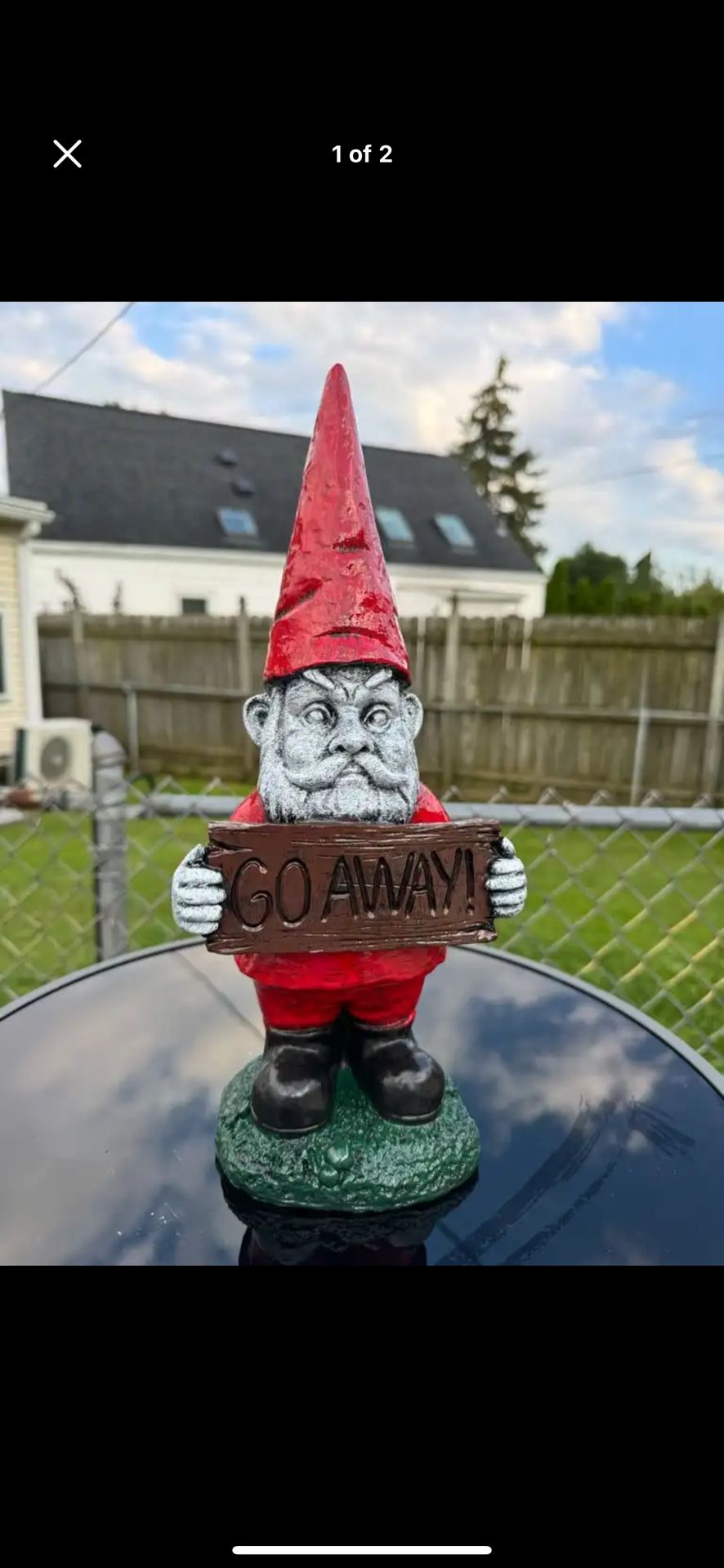 Gnome Holding Go Away Sign