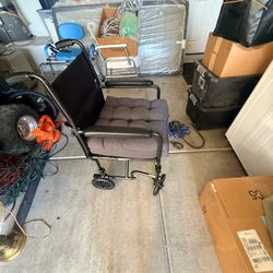 Folding transport chair with foot rest