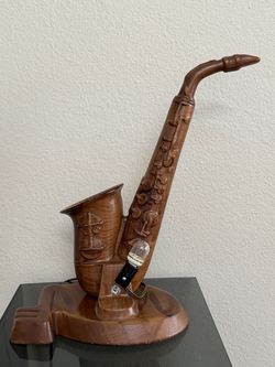 A handcrafted wood saxophone decorative sculpture with a small custom-wired accent light