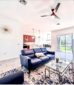 Blue leather sofa and chair