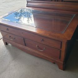 Solid Wood with glass Coffee table with display drawers in perfect condition you can use it as a tv stand as well 