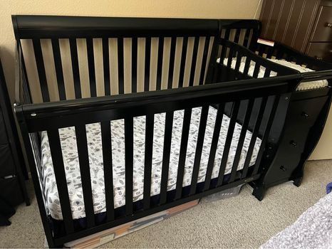 Baby crib with changing table and mattress included