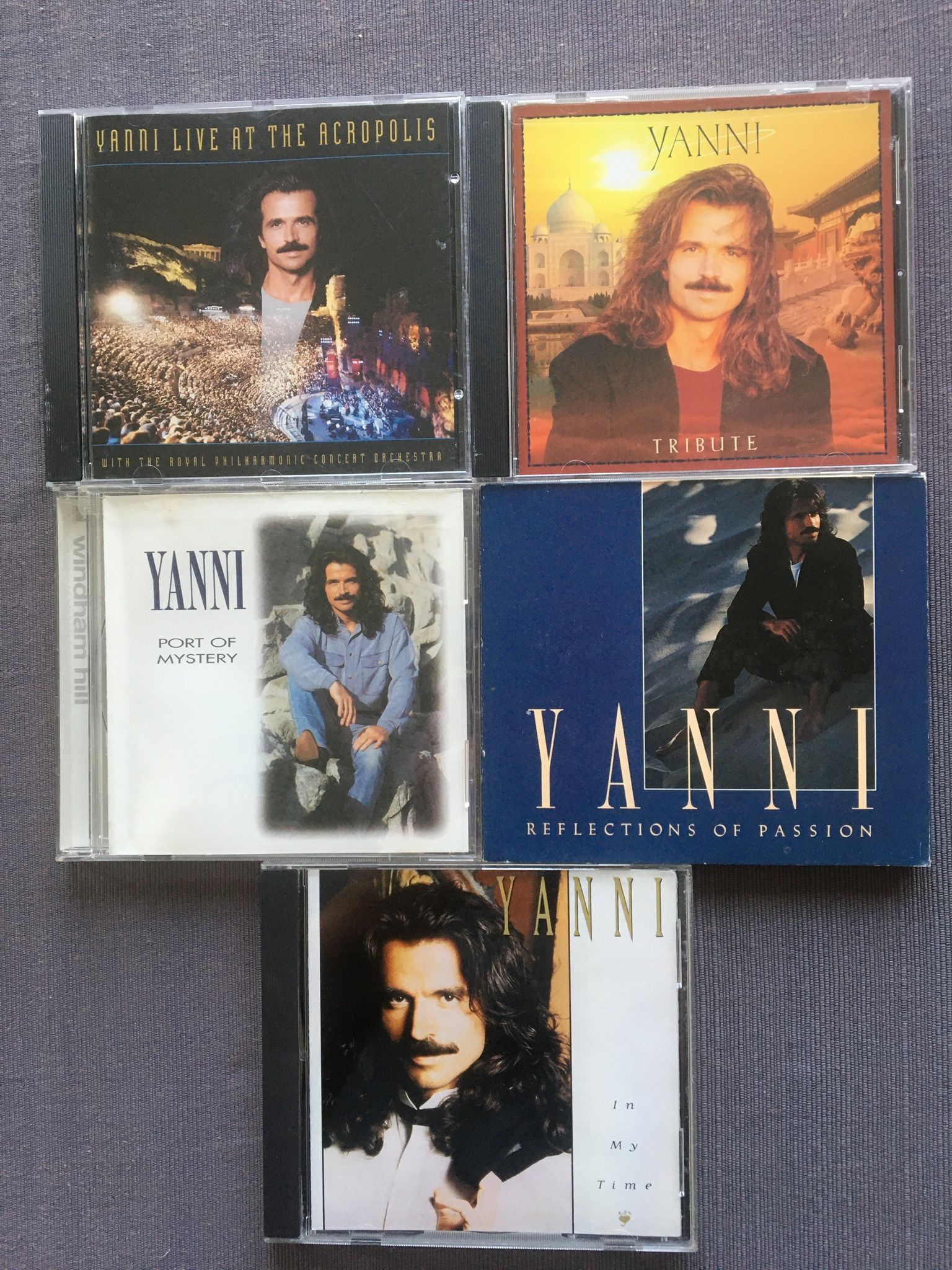 Yanni Music CD Collection Of His Classic Albums, lot of 5, new/excellent condition. Live At The Acropolis, In My Time, Reflections Of Passion, Trib