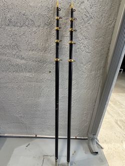 Pair of Black and Gold Fishing Rods