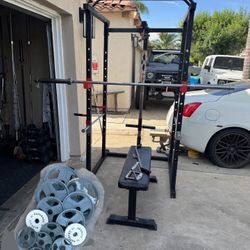 Bench press/squat rack with 7ft bar plus 265lbs of Olympic weights