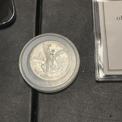 1 OZ Silver Coin. 