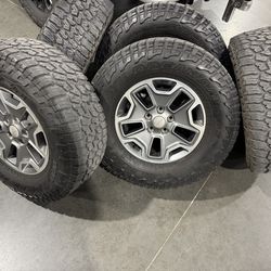 5 Jeep wrangler Rubicon rims/tires 17” Falken Wildpeak AT3 285/70/17 around 60% life