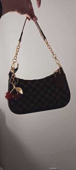 Brown Purse with charm.