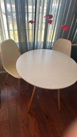 White table and four chairs.