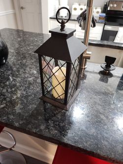 Candle light and holder cage