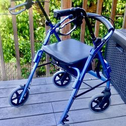 Beautiful metallic blue walker with hand brakes, storage compartment, back rest, 8" wheels.