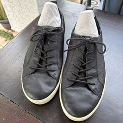 ECCO Soft 7 perforated leather sneakers in black.