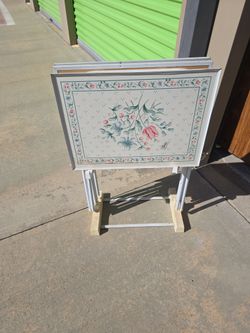 Set of three TV trays with flowers on them