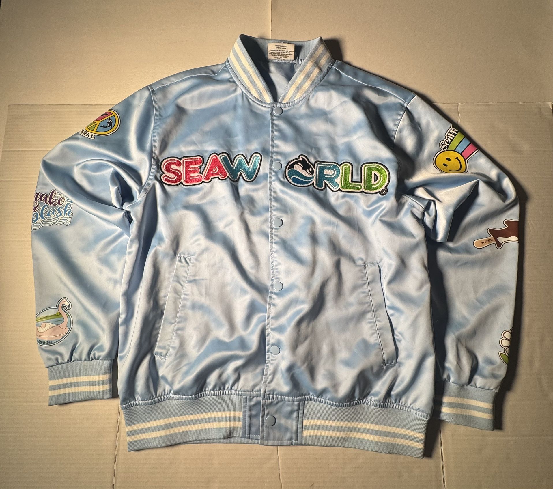 Pre Owned Good Last 7 Photos  I have not tried to remove marks SeaWorld  Varsity Bomber Jacket  Satin Embroidered  Printed Light Blue White Unisex Adu