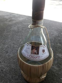 Unique empty wicker bottom enclosed bottle