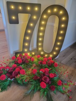 #70 Sign with Lights and Flower Arrangement
