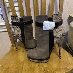 Gray high Heel Boots. Size 9