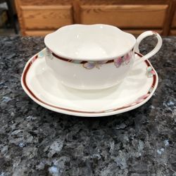 Rare bone China Korea Floral rim tea cup and saucer.  Floral rim Design - shallow cup. Korea . Approximate 1 3/4" tall and 5" across at the handle. Th