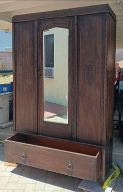 Vintage Armoire -2- pieces  Bottom  has a large drawer  , top has a beveled mirror on the door. Has some patina  but looks good. Needs a little touch 