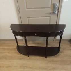 Negotiable dark brown TV stand in mint condition