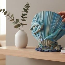 8" X 8" Blue Scallop Shell & Dolphins Sconce Wall Hanging/ Tabletop Decoration. Sconce can be used with artificial candles or artificial light sources