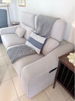 Gray loveseat motorized