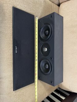 Polk Audio CS275 center channel speaker. Magnetically shielded center channel speaker designed for home theater systems. It is a 2-way, bass-reflex sp