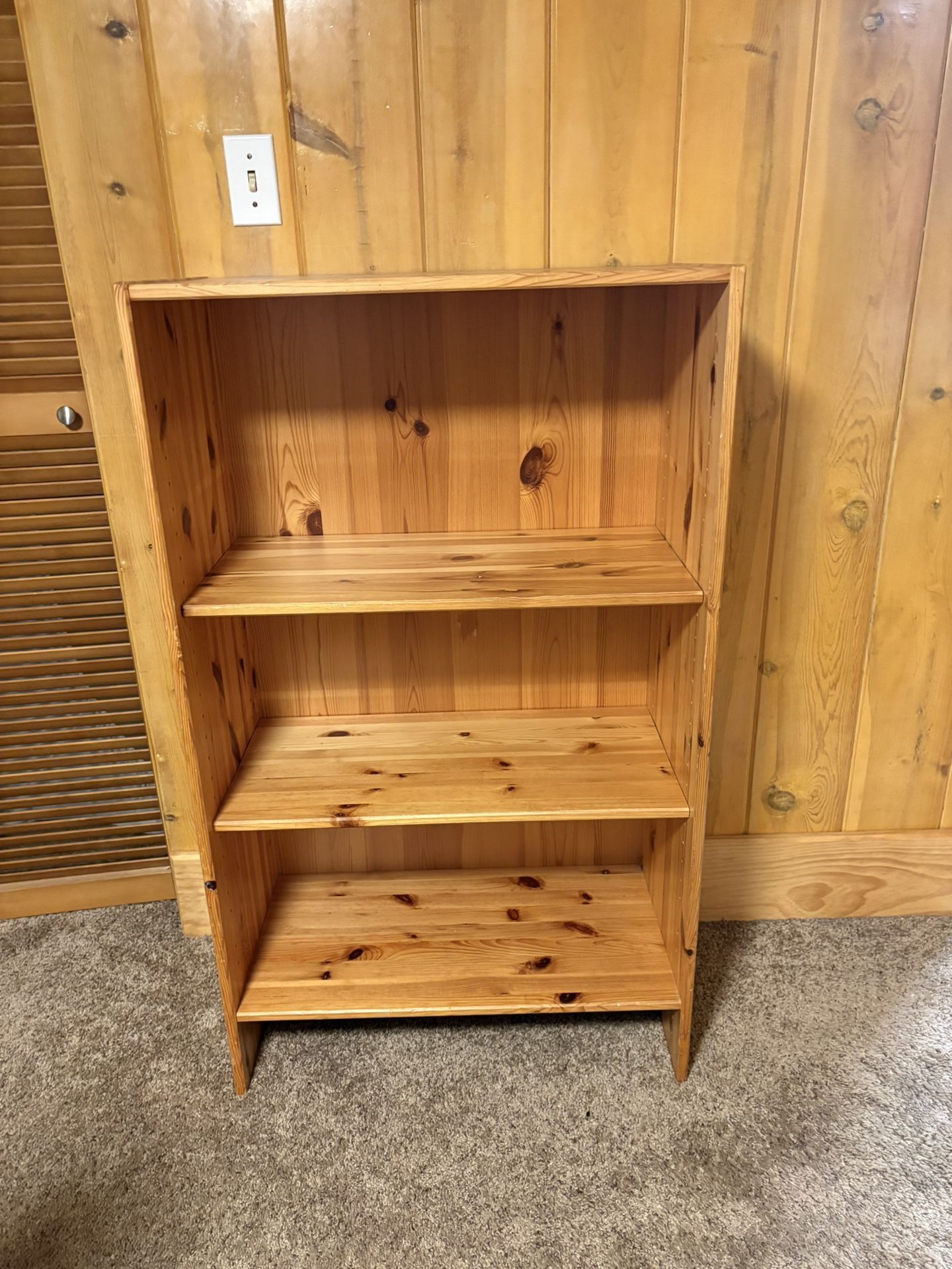 Knotty pine three-shelf bookcase