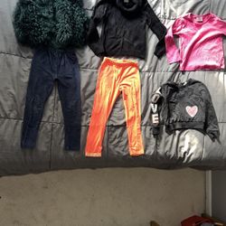 Size 5 toddler girl clothes. Green fuzzy vest does not have a tag. Pippa & julie jeggingshave snags but no holes. Emily rose orange legging hace pilli