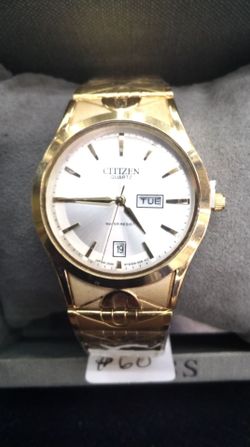Citizens Ladies Oval Gold Tone Watch with Date
