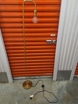 Brass Arc Floor Lamp with Globe Bulb