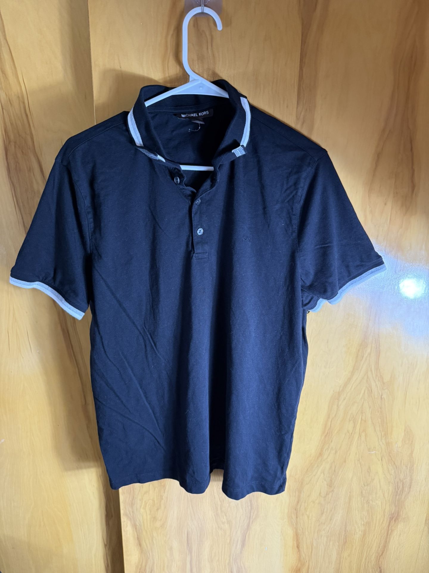 black Michael Kors men's short-sleeve polo shirt with white trim on the collar and sleeves Unused  Large on tag
