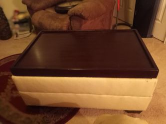 Ottoman mid heavy very sturdy it can hold my weight 255 pounds it is Ashley Furniture