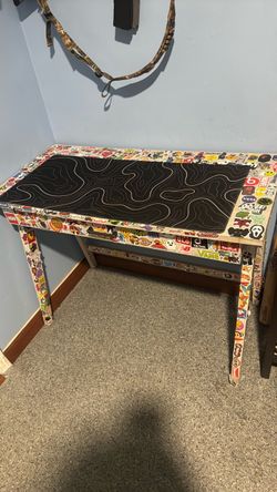 Desk from ikea with skateboarding stickers