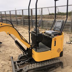New Mini Excavator  37 Inches Wide Digs 5.5 Feet Deep Has A Backfill Blade 