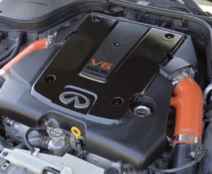 Who is missing Infiniti emblem on the engine cover?